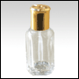 Clear glass octagonal perfume bottle with plastic applicator and golden cap.  Capacity : 10ml (1/3oz