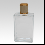 Elegant Clear glass bottle with Ivory Leather-type cap. Capacity: 102 mL (~3.45 