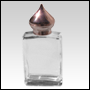 Elegant rectangular clear glass bottle with Copper minaret cap.
Capacity: 1/2oz (15ml) 