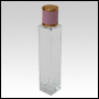 Sleek clear glass bottle with Pink Leather-type screw on cap. Capacity: 54 mL (~1.8 oz) at neck