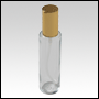 Cylindrical clear glass tall bottle with Gold treatment pump cap. Capacity: 3